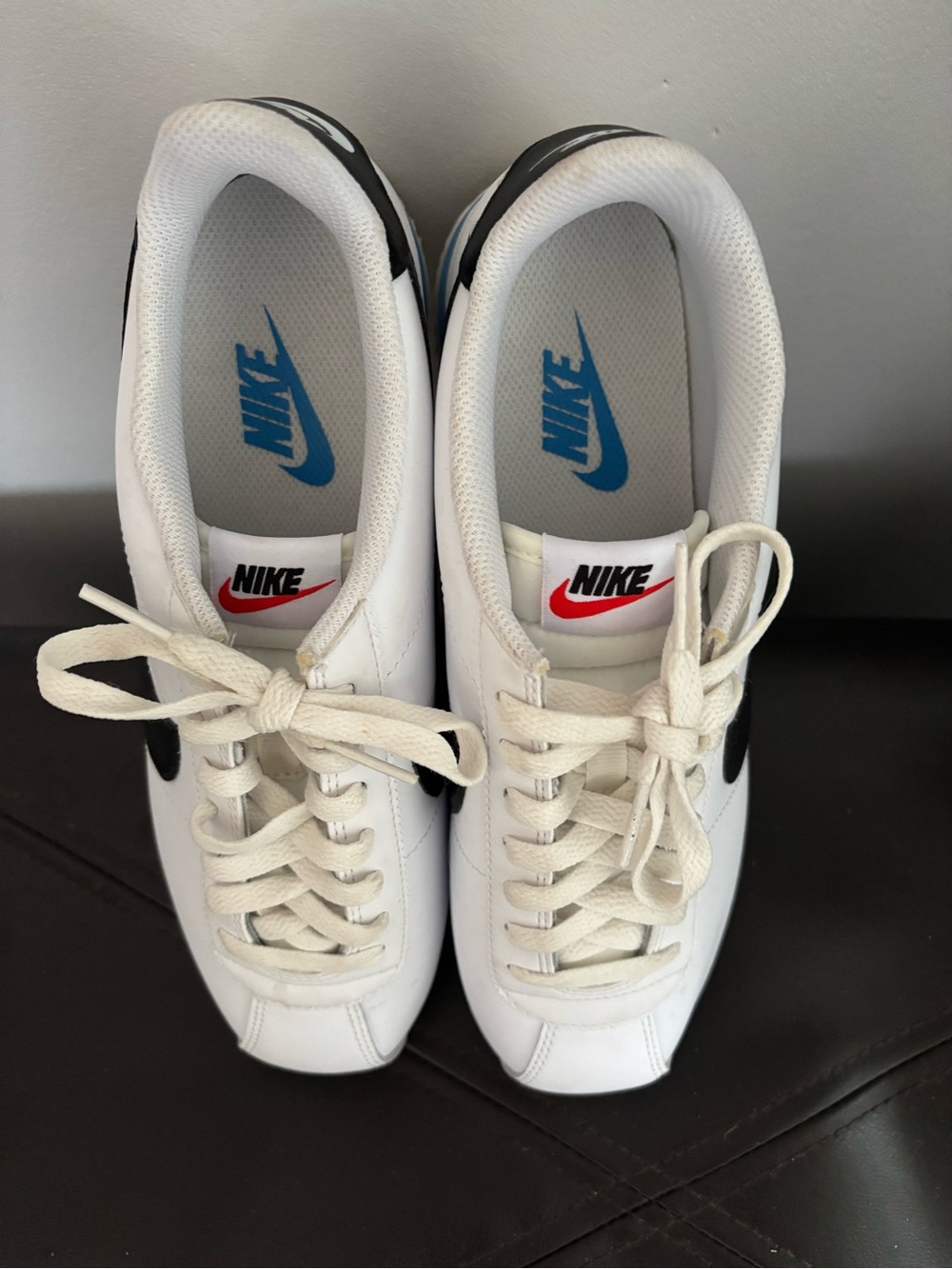 Nike Women's Retro White Sneakers with Black Swoosh. Never worn. No box